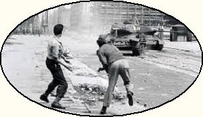 men throwing bricks at tanks