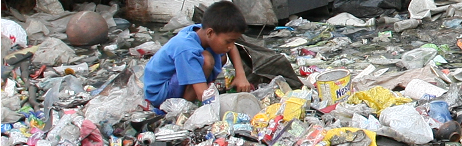 child at work sorting garbage